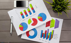 © - fotolia.com Financial paper charts and graphs on the table.